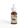 Peptide hair growth serum bottle with dropper on a white background